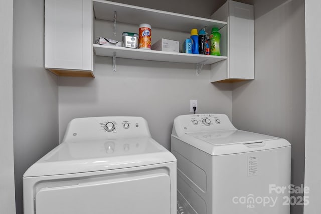 10327 Shelter Rock Ct, Charlotte, NC 28214 - laundry area with washer and clothes dryer and cabinet space