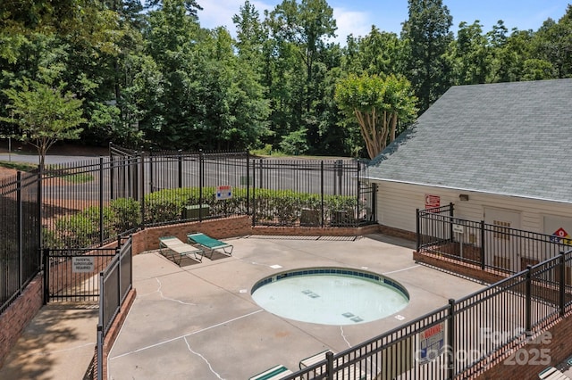 10327 Shelter Rock Ct, Charlotte, NC 28214 - view of swimming pool featuring a patio area and a hot tub