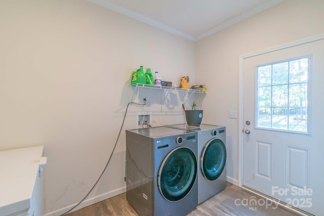 1811 Continental Dr, Albemarle, NC 28001 - laundry area featuring separate washer and dryer, wood finished floors, ornamental molding, and baseboards
