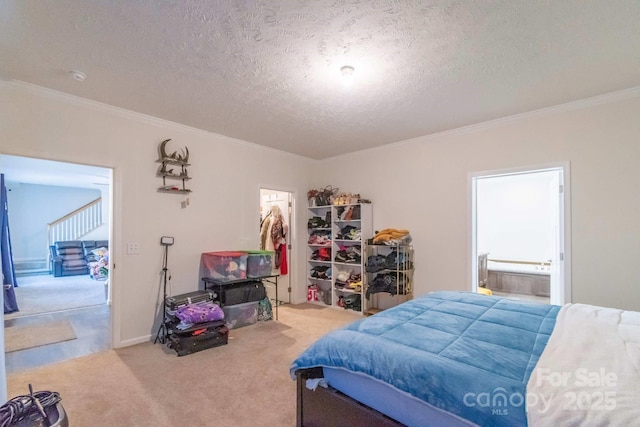 1811 Continental Dr, Albemarle, NC 28001 - carpeted bedroom with a textured ceiling, crown molding, and ensuite bath