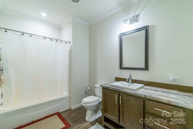 1811 Continental Dr, Albemarle, NC 28001 - bathroom with wood finished floors, vanity, toilet, ornamental molding, and shower / tub combo with curtain