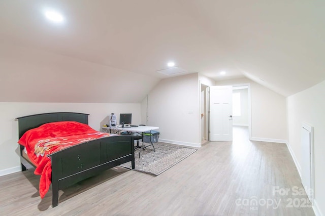 1811 Continental Dr, Albemarle, NC 28001 - bedroom with wood finished floors, lofted ceiling, and baseboards