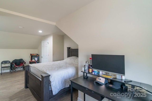 1811 Continental Dr, Albemarle, NC 28001 - bedroom featuring light wood-style floors, vaulted ceiling, and recessed lighting