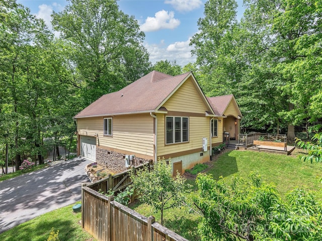 4 Alsatian Ln, Asheville, NC 28805 - view of property exterior with a garage, a deck, asphalt driveway, and a shingled roof