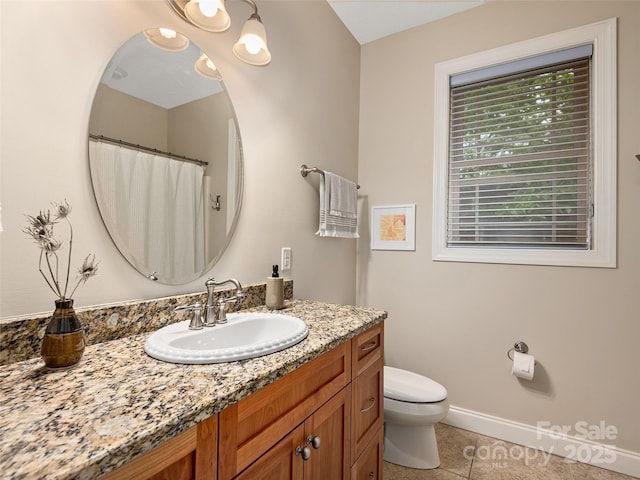 4 Alsatian Ln, Asheville, NC 28805 - full bath with tile patterned floors, toilet, vanity, and baseboards