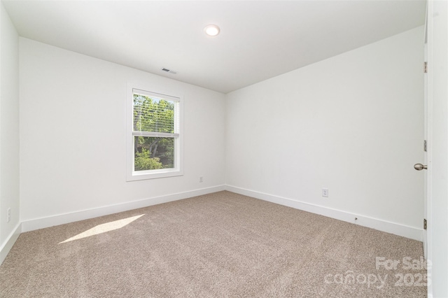 unfurnished room featuring carpet, baseboards, and recessed lighting