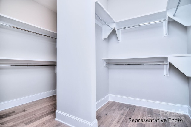 20392 Queens St, Cornelius, NC 28031 - spacious closet featuring wood finished floors
