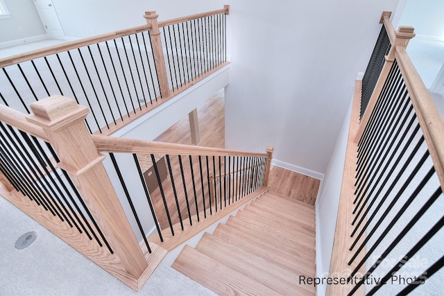 20392 Queens St, Cornelius, NC 28031 - staircase with baseboards and wood finished floors