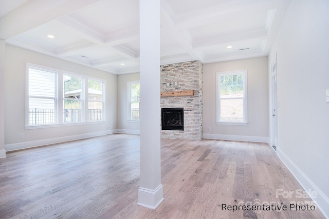 20392 Queens St, Cornelius, NC 28031 - unfurnished living room featuring coffered ceiling, light wood-style flooring, beam ceiling, ornamental molding, and a fireplace