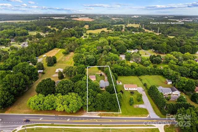 view of property location with property boundaries highlighted and a forest