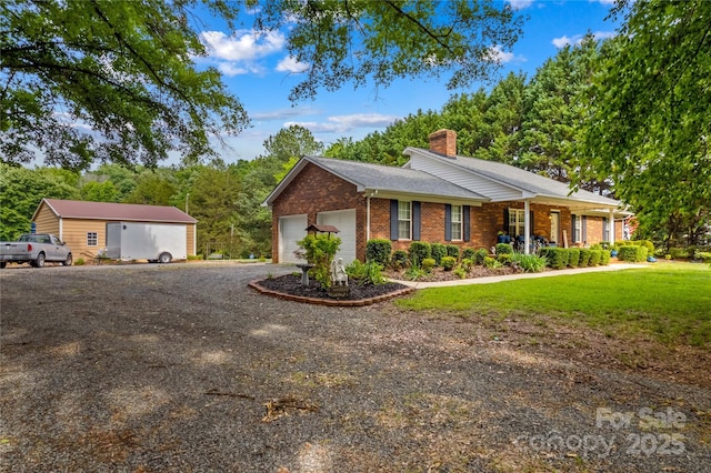 ranch-style home with brick siding, a chimney, dirt driveway, a porch, and a front yard