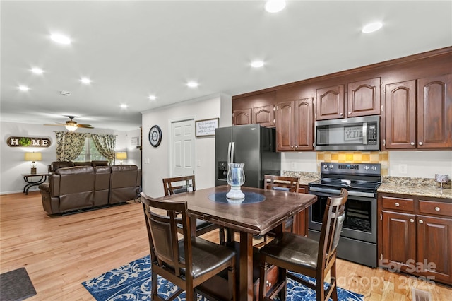 dining room featuring light wood-style flooring, recessed lighting, ceiling fan, and ornamental molding