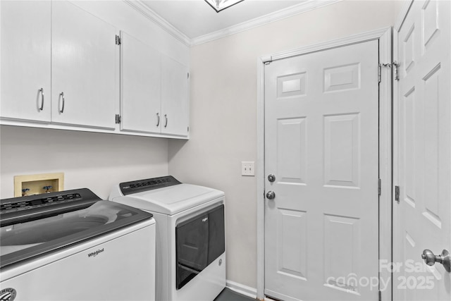 laundry area with cabinet space, crown molding, and washer and dryer