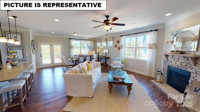 living room with wood finished floors, baseboards, ornamental molding, ceiling fan, and recessed lighting