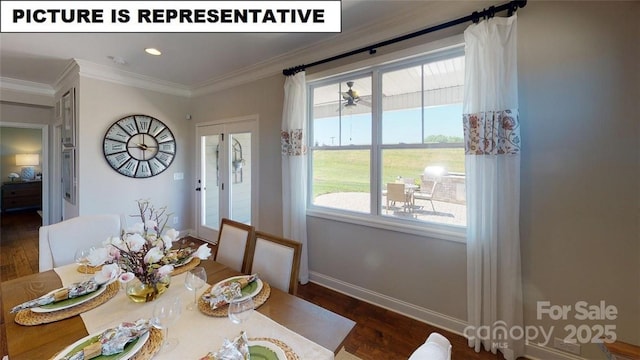 dining room featuring wood finished floors, baseboards, and crown molding