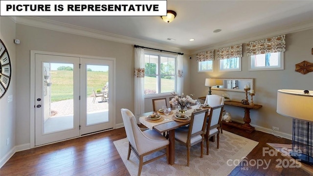dining space with crown molding, wood finished floors, and baseboards