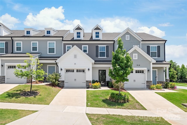 13221 Gadwal Pintail Dr, Charlotte, NC 28262 - view of front facade with stone siding, a front lawn, concrete driveway, and an attached garage