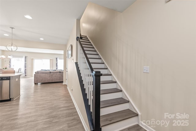 13221 Gadwal Pintail Dr, Charlotte, NC 28262 - stairs featuring recessed lighting, wood finished floors, and baseboards