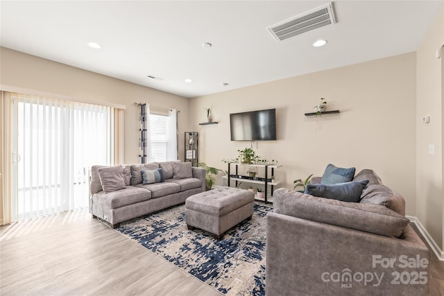 13221 Gadwal Pintail Dr, Charlotte, NC 28262 - living area featuring wood finished floors, recessed lighting, and baseboards