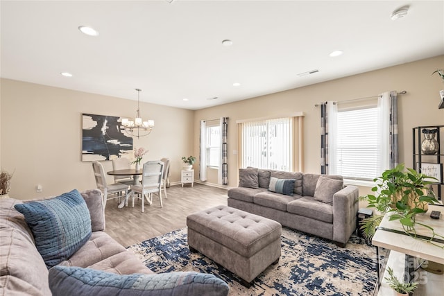 13221 Gadwal Pintail Dr, Charlotte, NC 28262 - living area featuring a chandelier, wood finished floors, recessed lighting, and baseboards