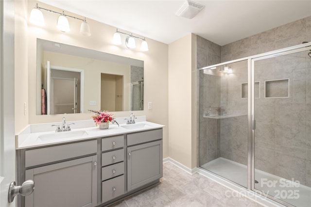 13221 Gadwal Pintail Dr, Charlotte, NC 28262 - bathroom featuring a shower stall, double vanity, and baseboards