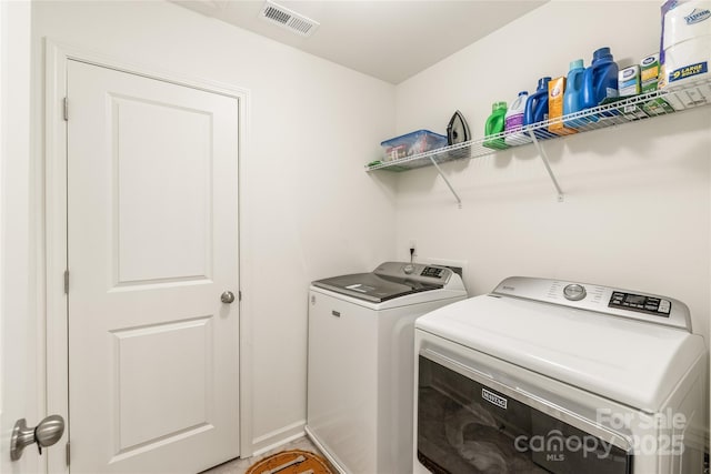 13221 Gadwal Pintail Dr, Charlotte, NC 28262 - laundry area featuring separate washer and dryer and baseboards