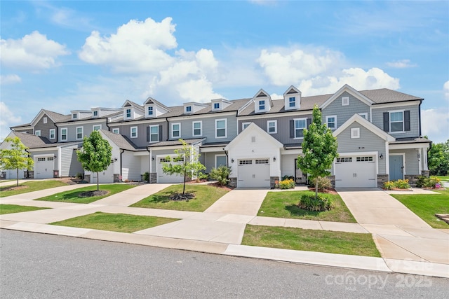 13221 Gadwal Pintail Dr, Charlotte, NC 28262 - townhome / multi-family property with stone siding, a residential view, concrete driveway, and an attached garage