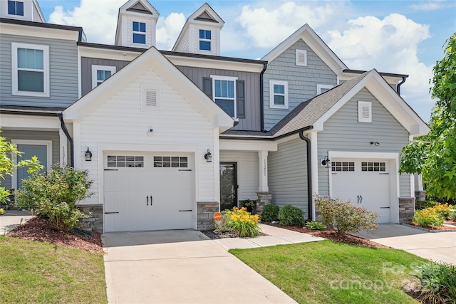 13221 Gadwal Pintail Dr, Charlotte, NC 28262 - craftsman-style house with concrete driveway, stone siding, and a front yard