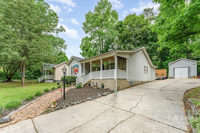 107 Oakland Rd, Belmont, NC 28012 - view of front of property featuring a porch, a detached garage, a front yard, and concrete driveway