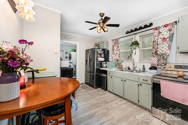 107 Oakland Rd, Belmont, NC 28012 - kitchen with appliances with stainless steel finishes, a sink, ornamental molding, light wood-type flooring, and light countertops