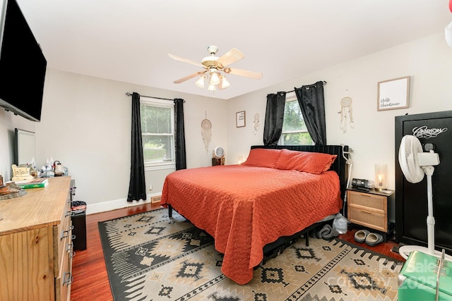 107 Oakland Rd, Belmont, NC 28012 - bedroom featuring wood finished floors, a ceiling fan, and baseboards