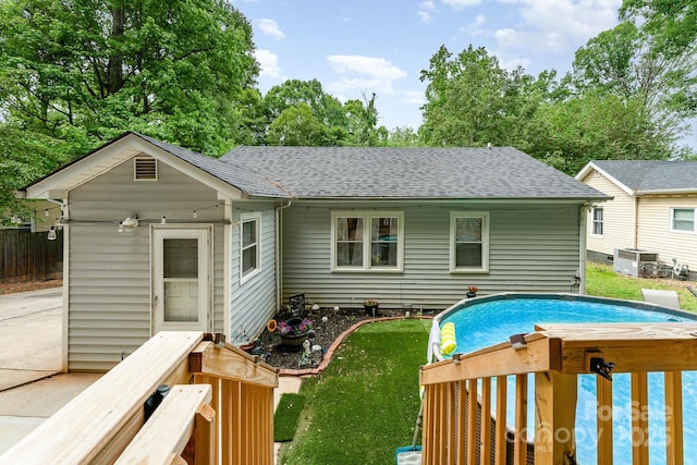 107 Oakland Rd, Belmont, NC 28012 - back of property with a shingled roof and central AC