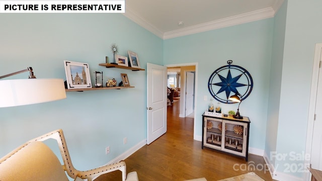 sitting room with crown molding, wood finished floors, and baseboards