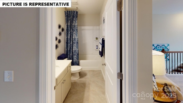 bathroom with vanity, toilet, and tile patterned floors