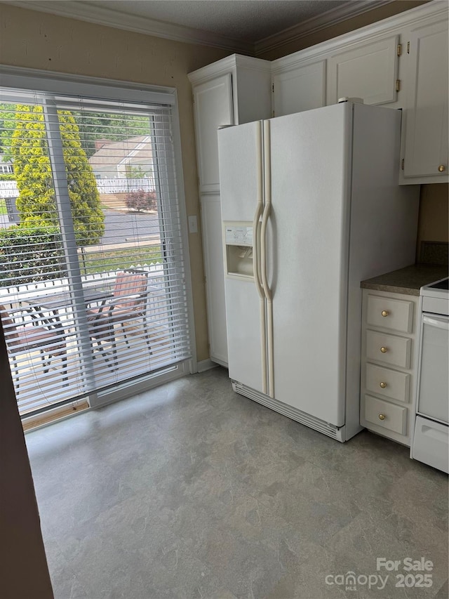 303 Eastwood Dr, Salisbury, NC 28146 - kitchen featuring white refrigerator with ice dispenser, ornamental molding, range, white cabinetry, and dark countertops