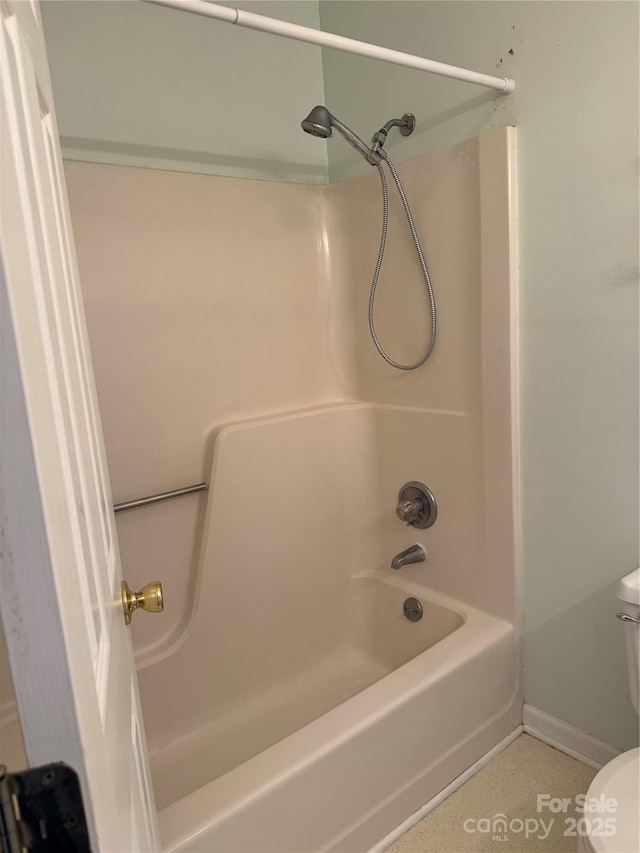 303 Eastwood Dr, Salisbury, NC 28146 - bathroom with toilet, shower / bath combination, and baseboards