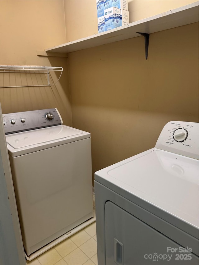 303 Eastwood Dr, Salisbury, NC 28146 - laundry area with separate washer and dryer and light tile patterned floors