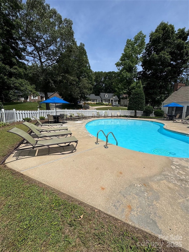 303 Eastwood Dr, Salisbury, NC 28146 - community pool featuring a patio area and view of scattered trees