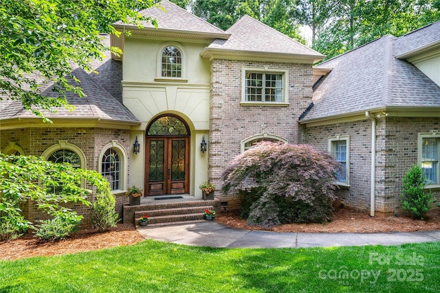122 Sleepy Cove Trl, Mooresville, NC 28117 - french country home featuring french doors, stucco siding, a shingled roof, and brick siding