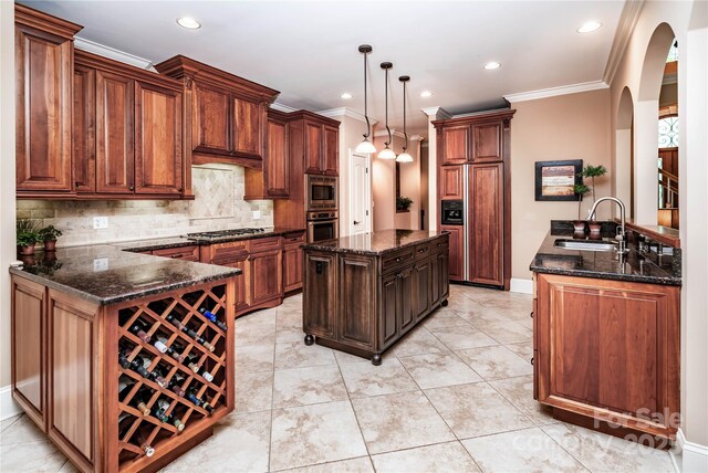 122 Sleepy Cove Trl, Mooresville, NC 28117 - kitchen featuring built in appliances, arched walkways, a peninsula, backsplash, and crown molding