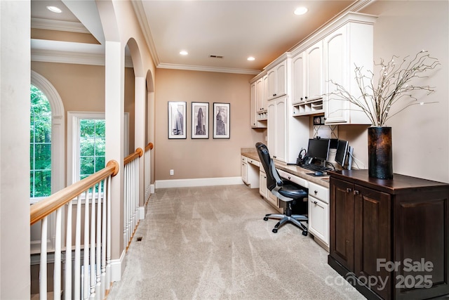 122 Sleepy Cove Trl, Mooresville, NC 28117 - home office featuring light carpet, crown molding, built in desk, recessed lighting, and arched walkways