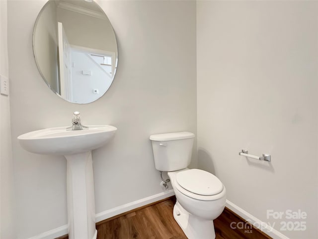 10319 Willingham Rd, Huntersville, NC 28078 - bathroom with baseboards, wood finished floors, and toilet