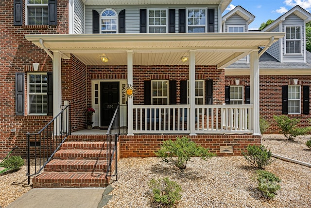 220 Glenville Dr, Fort Mill, SC 29715 - view of front facade featuring brick siding and covered porch