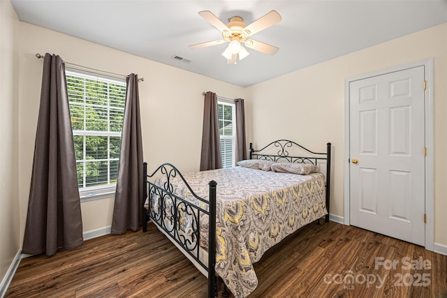 220 Glenville Dr, Fort Mill, SC 29715 - bedroom featuring dark wood-style floors, multiple windows, and ceiling fan