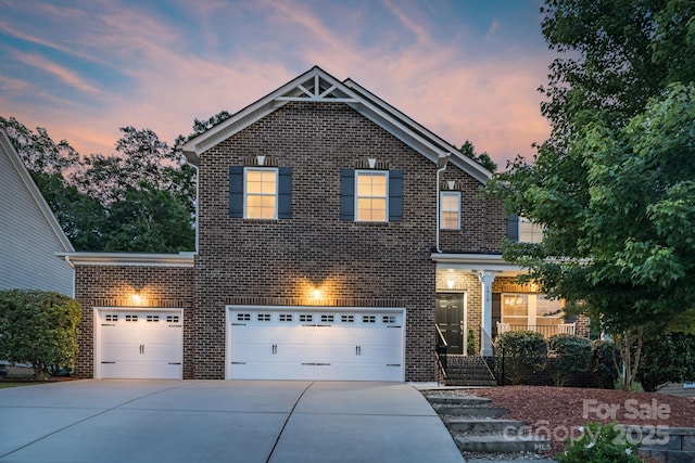 1919 Madeira Cir, Waxhaw, NC 28173 - traditional-style home featuring brick siding, concrete driveway, and an attached garage