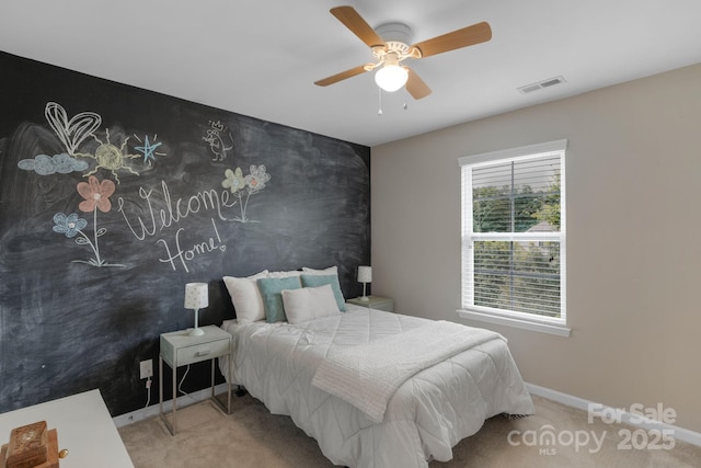 1919 Madeira Cir, Waxhaw, NC 28173 - bedroom with carpet flooring, baseboards, an accent wall, and ceiling fan