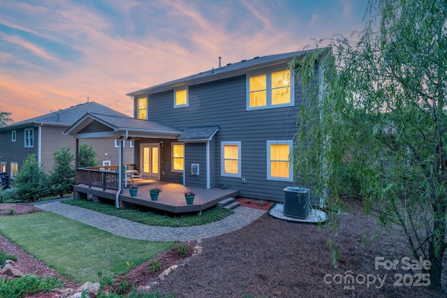 1919 Madeira Cir, Waxhaw, NC 28173 - back of house featuring central air condition unit, a lawn, and a wooden deck