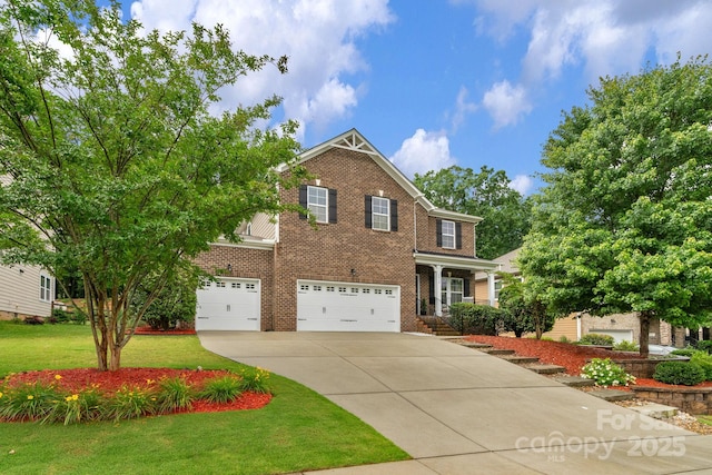 1919 Madeira Cir, Waxhaw, NC 28173 - view of front of house featuring driveway, brick siding, a garage, and a front yard