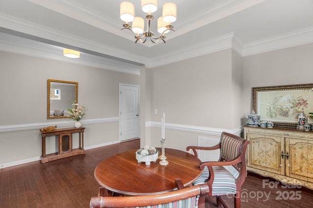 1919 Madeira Cir, Waxhaw, NC 28173 - dining space with a chandelier, wood-type flooring, crown molding, and baseboards