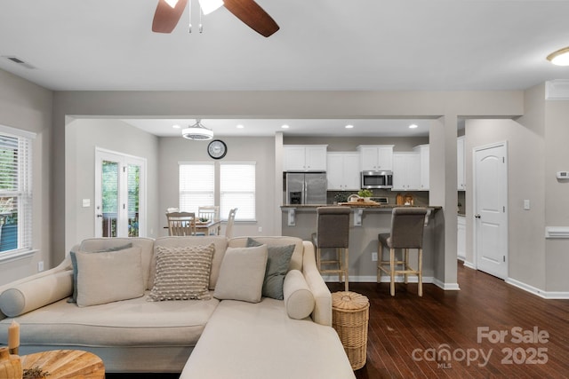 1919 Madeira Cir, Waxhaw, NC 28173 - living room featuring dark wood-type flooring, a ceiling fan, recessed lighting, and baseboards